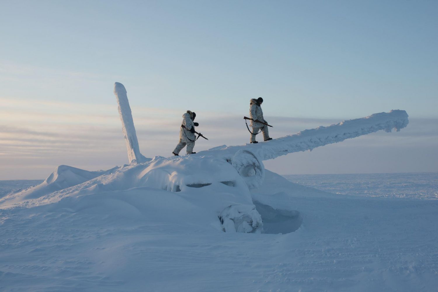 Canadian soldiers walking on the wreckage of an airplane, -50 Celsius, Resolute Bay, Nunavut, Canada